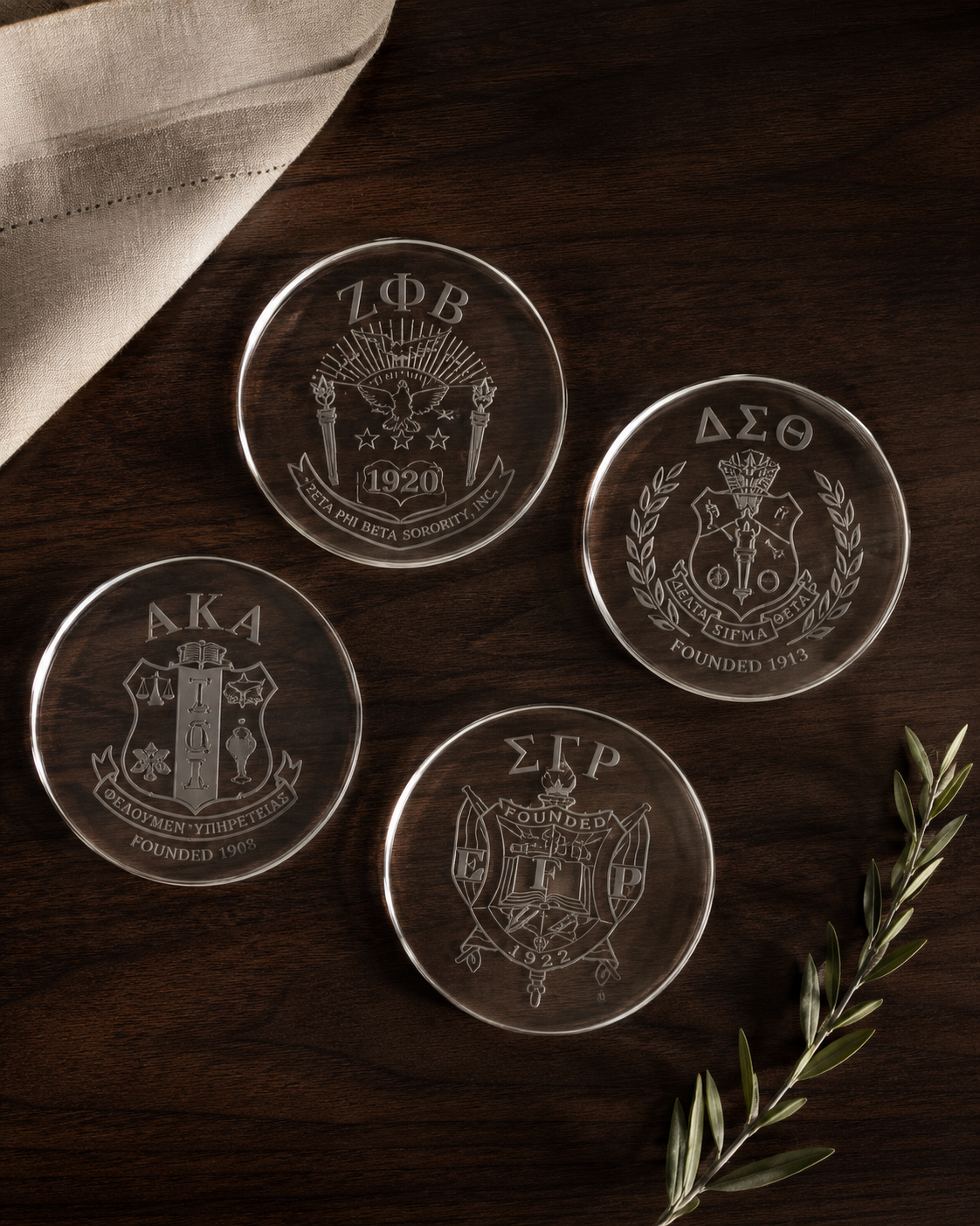 Custom etched BGLO coaster set — ZΦB, ΔΣΘ, AKA, ΣΓΡ crests